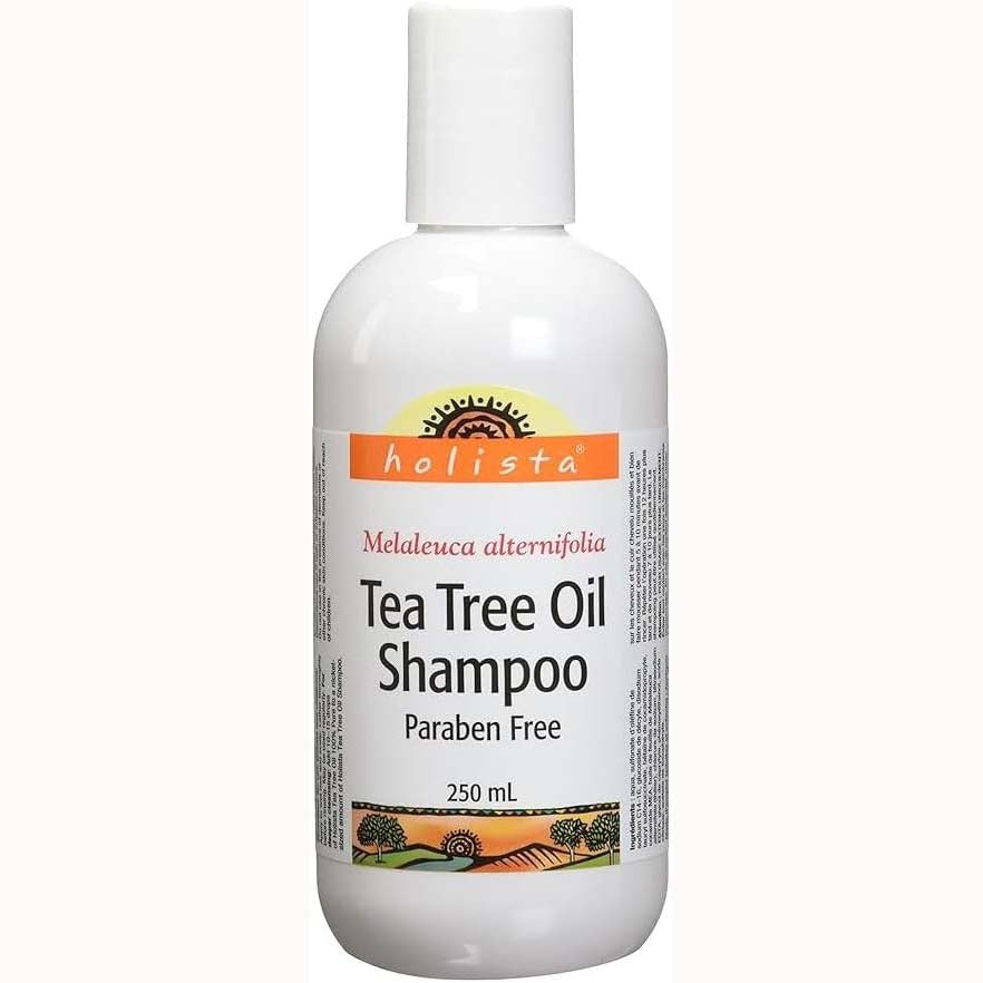 A white plastic bottle of Holista Tea Tree Oil Shampoo with a white cap, shown against a plain off-white background. Buy Online natvd.com