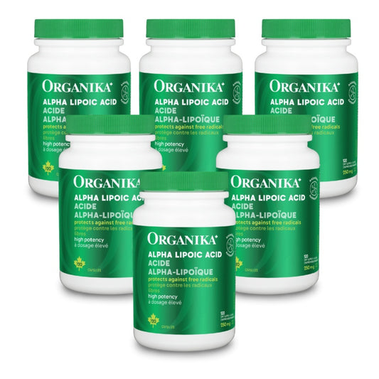 Six white bottles of Organika Alpha Lipoic Acid dietary supplements with green caps and green labels, arranged on a plain white background. natvd Canadian label